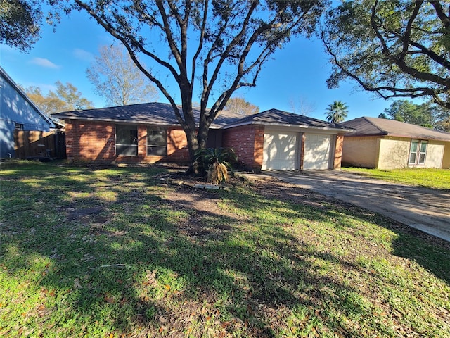 ranch-style home featuring a garage and a front yard