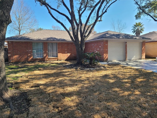 single story home featuring a garage and a front lawn