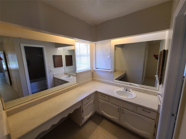 bathroom featuring tile patterned floors and vanity