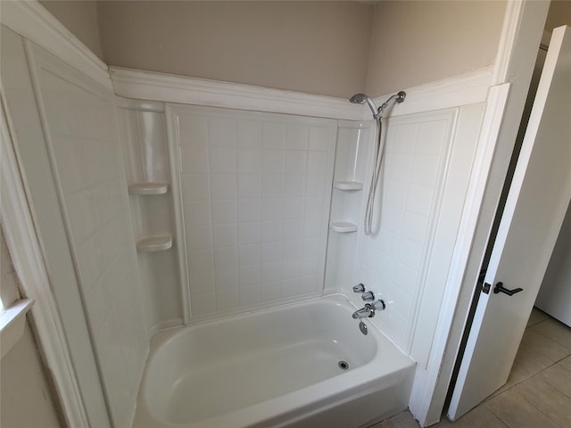 bathroom featuring bathing tub / shower combination and tile patterned flooring