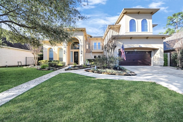 view of front facade featuring a garage and a front lawn