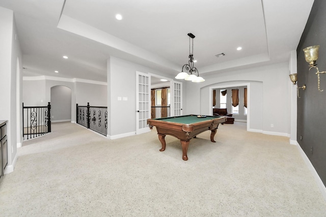 playroom with billiards, a tray ceiling, light carpet, and french doors