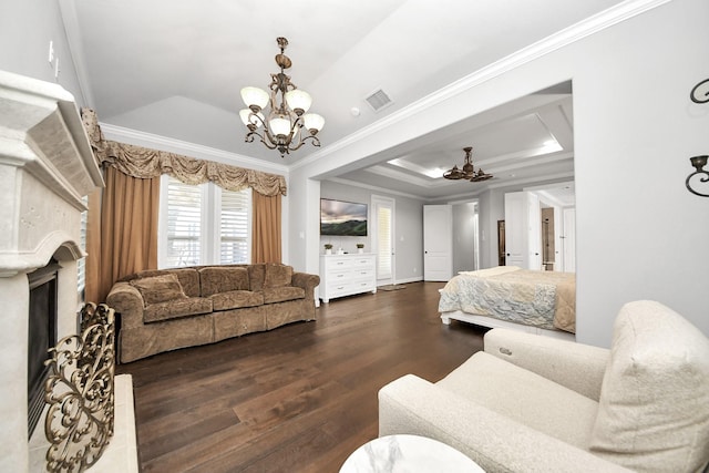 bedroom featuring crown molding, dark wood-type flooring, a notable chandelier, and a tray ceiling