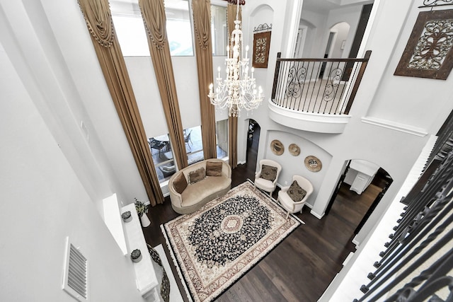 interior space featuring hardwood / wood-style flooring and a chandelier