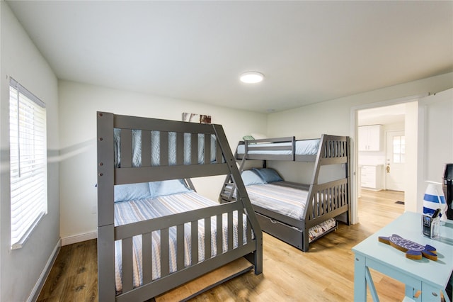 bedroom with wood-type flooring