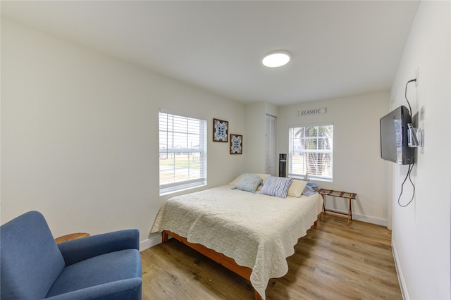 bedroom with light wood-type flooring