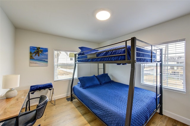 bedroom with wood-type flooring