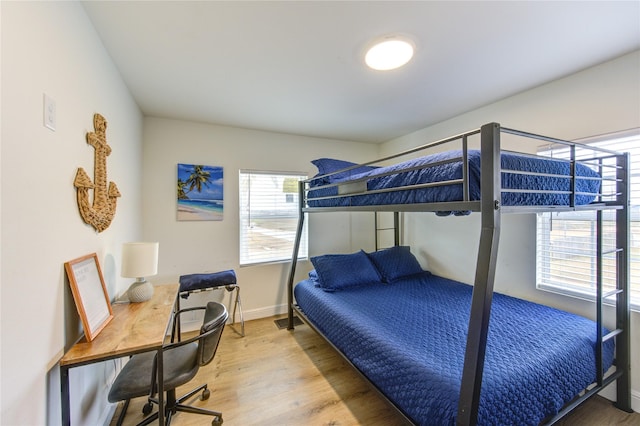 bedroom with hardwood / wood-style flooring