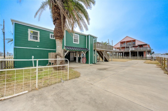 view of front of property featuring a carport