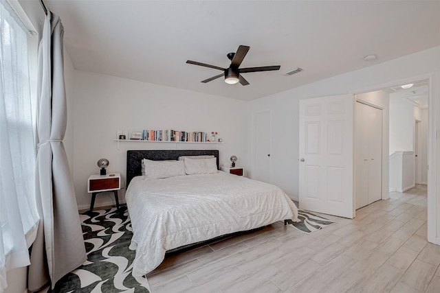 bedroom with ceiling fan and light hardwood / wood-style flooring