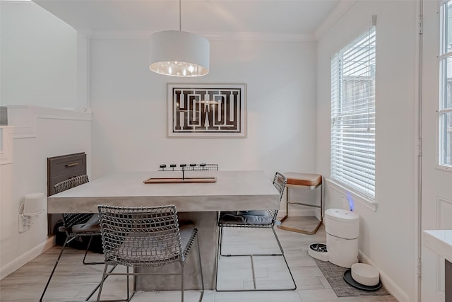 dining area featuring crown molding