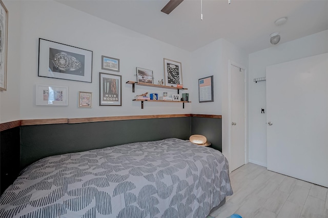 bedroom featuring ceiling fan and light hardwood / wood-style flooring