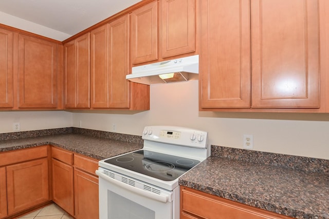 kitchen featuring white electric range and light tile patterned floors