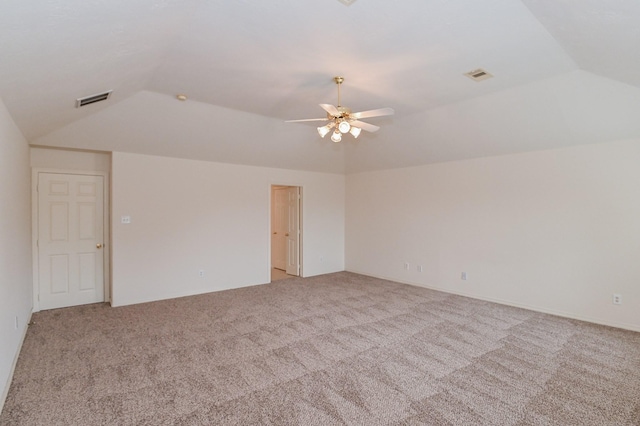 unfurnished room featuring ceiling fan, light colored carpet, and vaulted ceiling