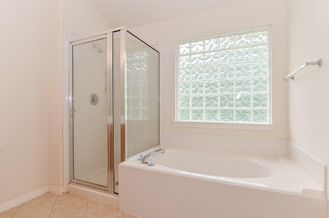 bathroom featuring tile patterned flooring and independent shower and bath