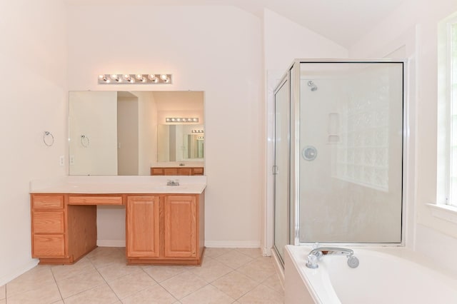 bathroom with independent shower and bath, vanity, lofted ceiling, and tile patterned floors