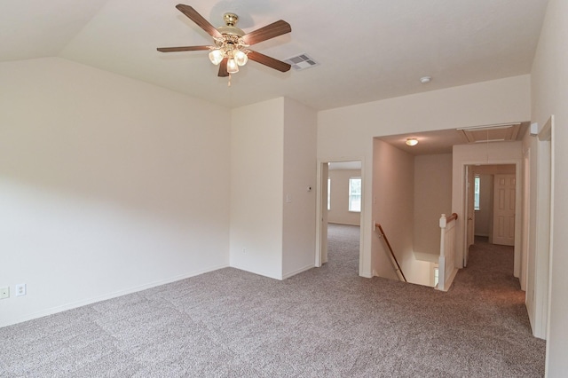 carpeted spare room with lofted ceiling and ceiling fan