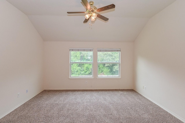 unfurnished room featuring carpet floors, vaulted ceiling, and ceiling fan