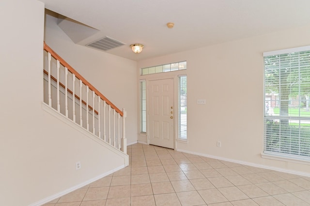 tiled foyer with plenty of natural light