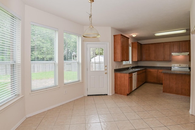 kitchen featuring stove, light tile patterned floors, decorative light fixtures, and dishwasher