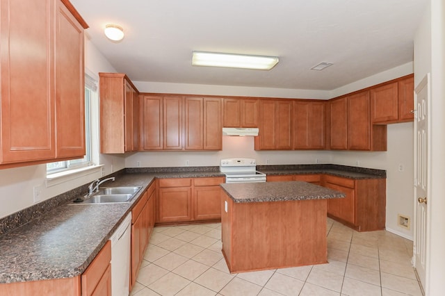 kitchen featuring white appliances, a center island, sink, and light tile patterned floors