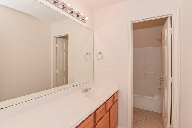 bathroom with tile patterned flooring, vanity, and shower / tub combination