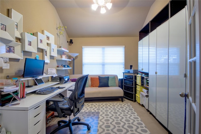 office with ceiling fan, vaulted ceiling, and light carpet