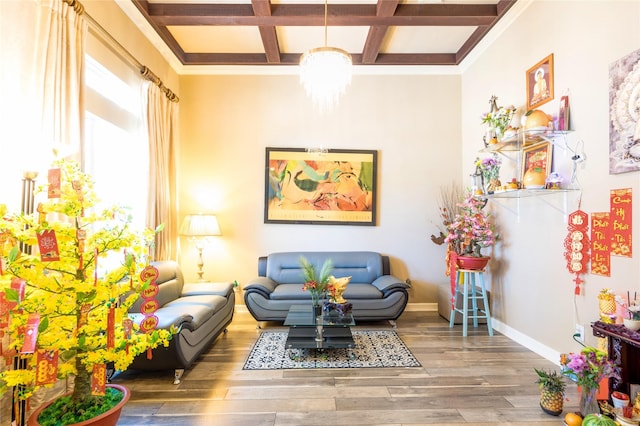 sitting room featuring coffered ceiling, a chandelier, hardwood / wood-style floors, and beam ceiling