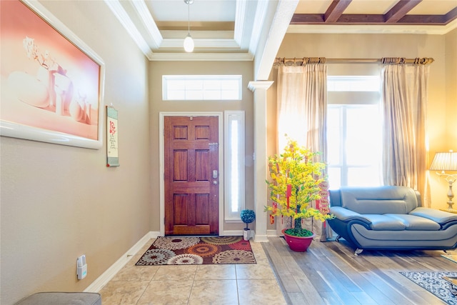 foyer featuring a wealth of natural light and ornamental molding