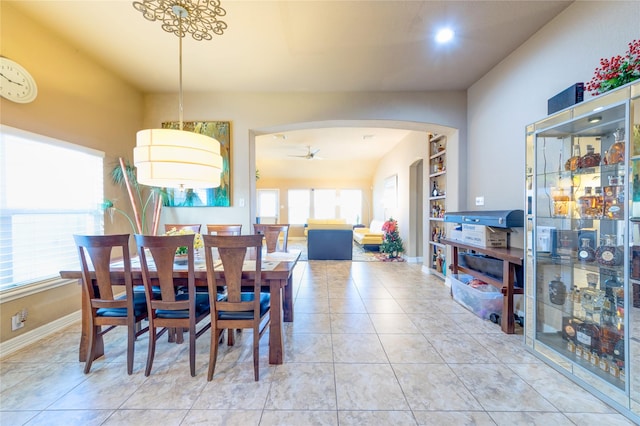 tiled dining room with ceiling fan