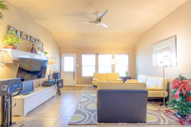 tiled living room featuring lofted ceiling and ceiling fan