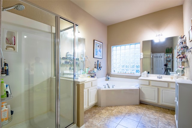 bathroom with vanity, tile patterned floors, and independent shower and bath