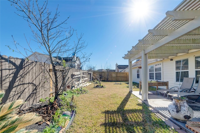 view of yard with a pergola and a patio area