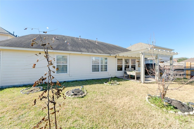 rear view of house with a yard, a patio area, and a pergola