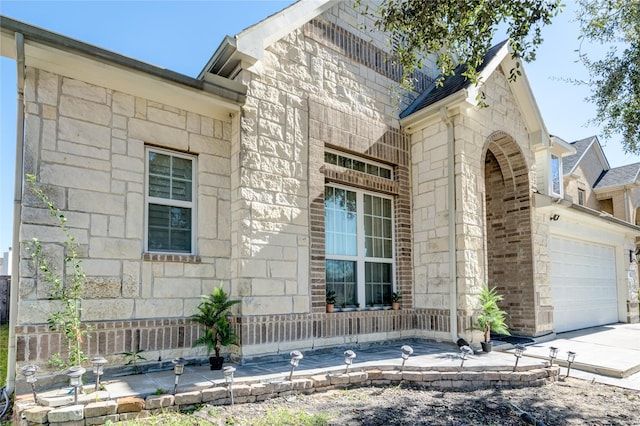 view of side of home featuring a garage