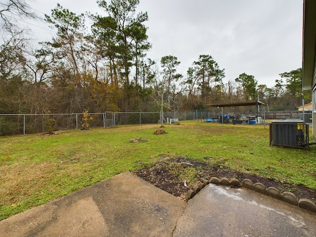 view of yard with cooling unit and a fenced backyard