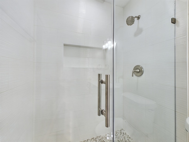 full bath featuring a shower stall