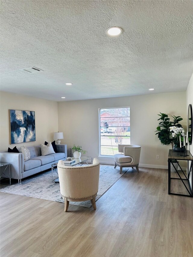 living room with light hardwood / wood-style flooring