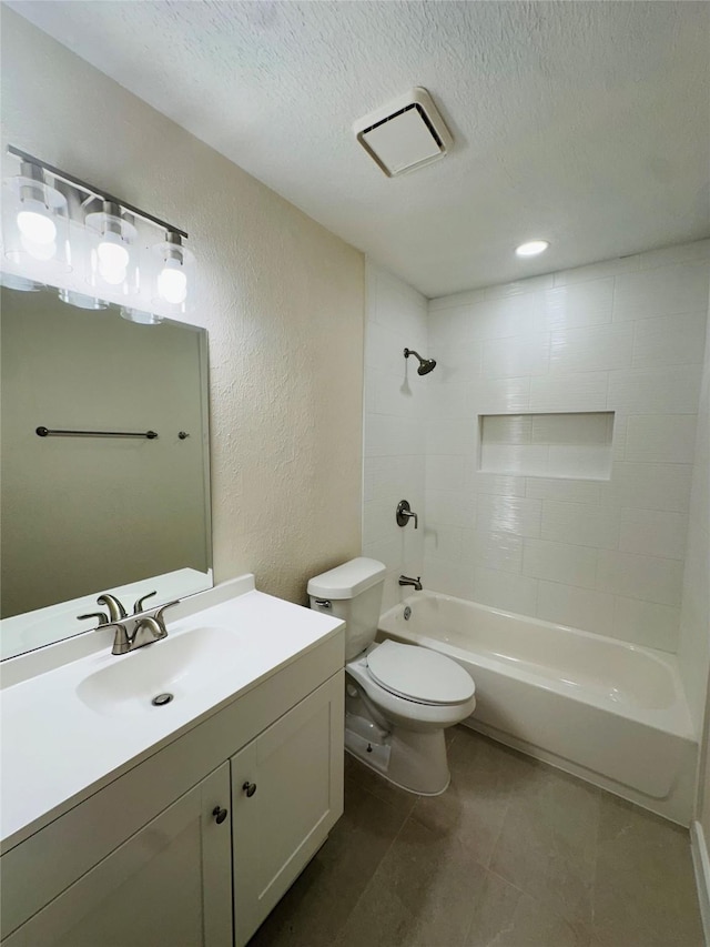 full bathroom featuring visible vents, tub / shower combination, a textured ceiling, toilet, and a textured wall