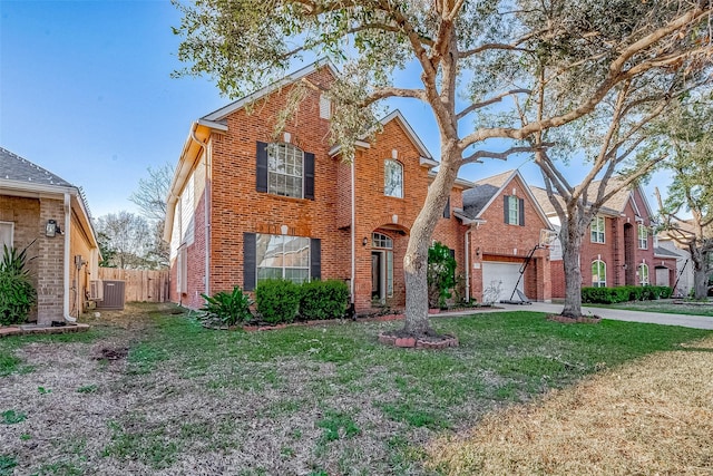 front of property with a garage, central AC, and a front yard