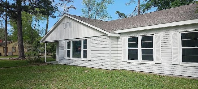 view of home's exterior featuring a yard