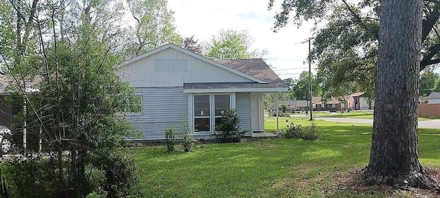 exterior space with a yard