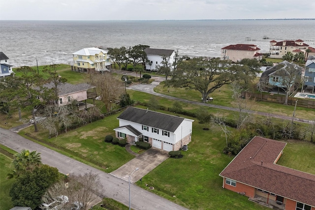 birds eye view of property with a water view