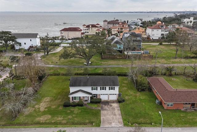 birds eye view of property with a water view