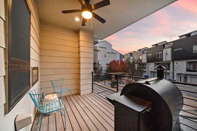 balcony at dusk featuring a grill and ceiling fan