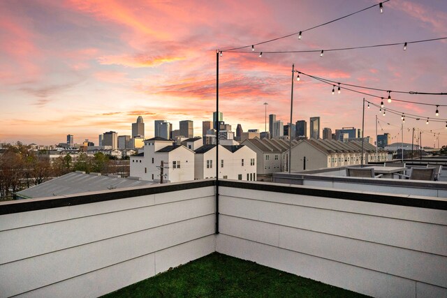 view of balcony at dusk