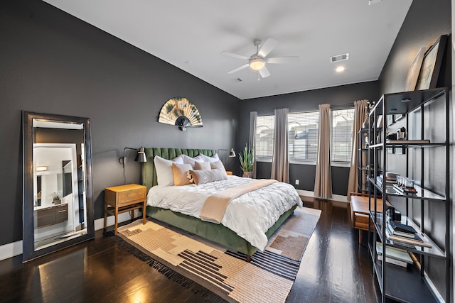 bedroom featuring lofted ceiling and dark hardwood / wood-style floors