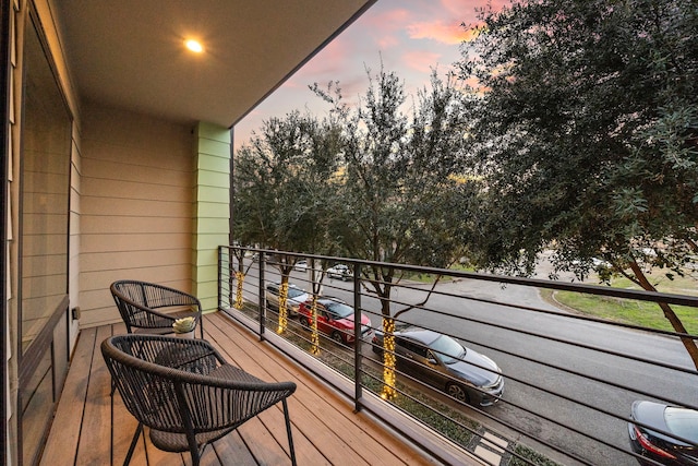 view of balcony at dusk