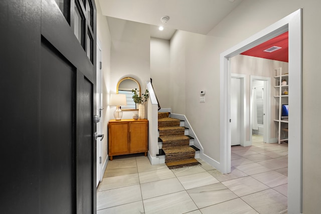 entrance foyer featuring light tile patterned flooring