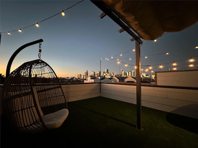 view of patio terrace at dusk